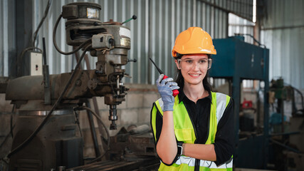 Portrait of Industrial engineers with machines at factory machines.