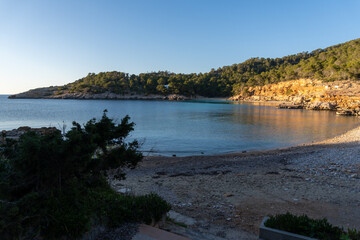 Cala Salada, on the island of Ibiza, with the turquoise beach, without people on a sunny day.