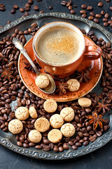 Almond cookies and cup of aromatic coffee