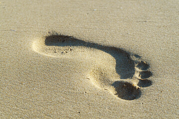 Fototapeta na wymiar Footprint of a man in the sand