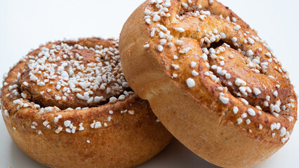 Two isolated cinnamon buns on white background. 