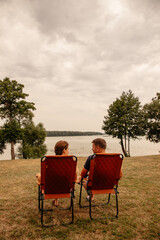 couple sitting at a lake