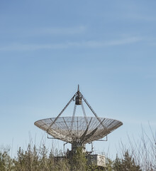 The metal structure of the astronomical radio telescope observatory on the territory of the Institute of the Ionosphere in the Kharkov region, on a spring sunny day