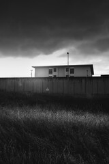 Fototapeta premium A prison with high concrete walls and barbed wire. 