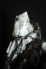 Clear barite crystal on black background. macro detail texture background. close-up raw rough...