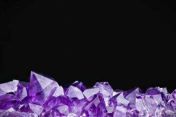 amethyst druse on black background. macro detail texture background. close-up raw rough unpolished...