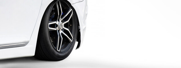 White sports car coupe parked on a white background, panoramic banner with copy space.