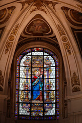 Stained glass in St. Roch church, Paris. France.