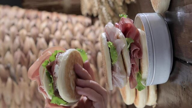tigelle or crescentine homemade, con prosciutto, salame, stracciatella liquida. Italian food typical of the area of Modena, Emilia-Romagna. Thin round breads stuffed with prosciutto. 4k footage