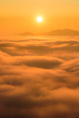 Cloud inversion above the CHKO Ceske Stredohori in Czechia during autumn sunset.
