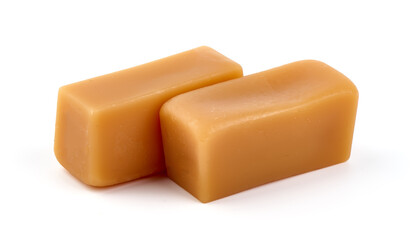 Caramel candies with caramel sauce, isolated on white background.