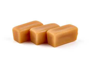 Caramel candies with caramel sauce, isolated on white background.