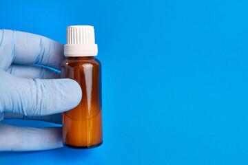 They hold medical syrup in their hands. Treatment of respiratory diseases.