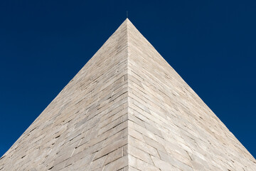 White marble Pyramid of Cestius, now part of Rome ancient walls, erected in the 1st century BC