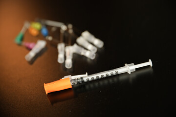 flu vaccine and needle syringes showing opioid crisis needle therapy and virus - obrazy, fototapety, plakaty