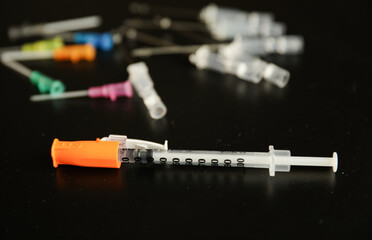 flu vaccine and needle syringes showing opioid crisis needle therapy and virus