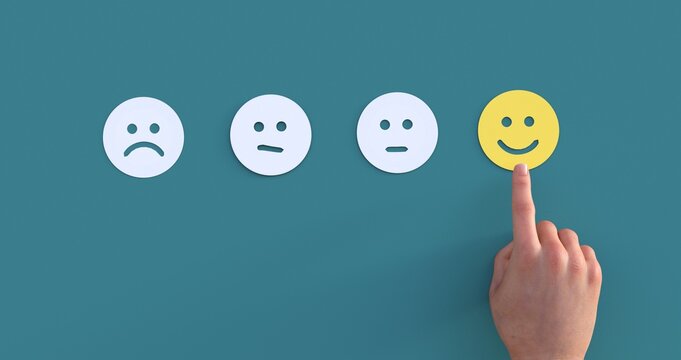 client's hand picked the happy face smile face, Customer service evaluation and satisfaction survey concept. copy space