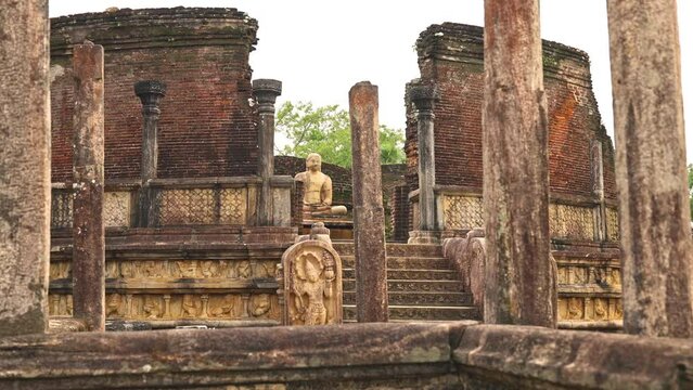 Ancient ruins of Vatadage stupa with a Buddha statue in the center, Pollonnaruwa, Sri Lanka