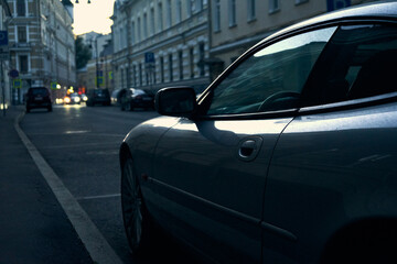 Сlose-up of a sports car in a blue light on a Moscow street