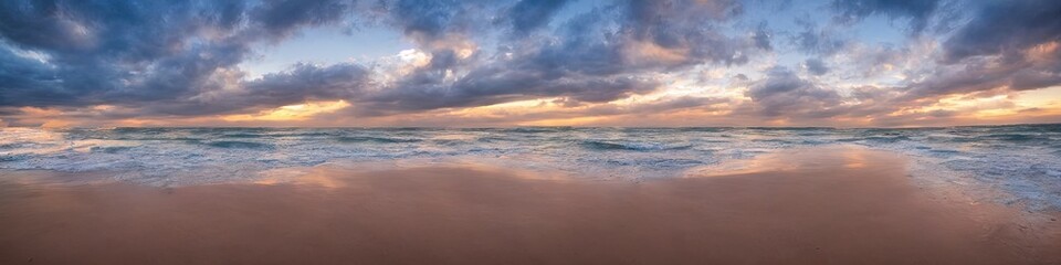 Obraz premium Sandy deserted beach with ocean waves on the shore. Skies and water meet on the horizon by generative AI