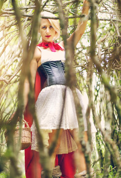 Red Riding Hood pretend in the forest