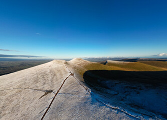 Aerial view of Pen-y-Fan in the Brecon Beacons with a light dusting of snow