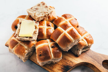Easter Breakfast with Hot Cross Buns, served on Wooden Chopping Board. Top View