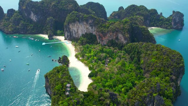Koh Hong, located in Krabi Province in Thailand, is a breathtakingly beautiful island that boasts crystal-clear waters and pristine white sand beaches. including towering limestone cliffs. 4K Drone

