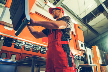 Industrial Bending Machine Operator at Work