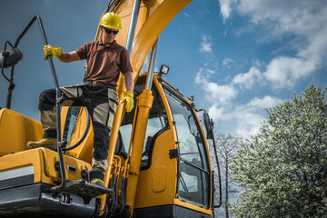 Excavator Operator Standing on His Heavy Duty Machine