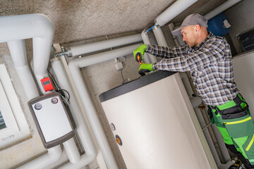 Professional Plumber Repairing Residential Boiler