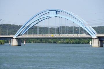 TGV railway train bridge over the river Rhone, France with a blur arch steel metal