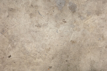 Gray wall background. The wall is worn and old. Plaster texture