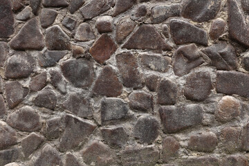Stone wall background. The wall is ancient. Stone texture. River stone