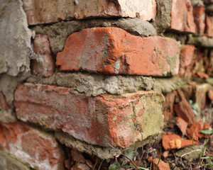 Brick wall. Red brick, old and ruined. Brickwork