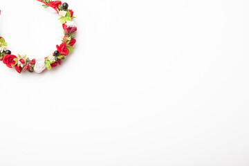 wreath with colored flowers isolated on white