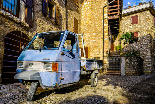 Malcesine, Italy - November 7: vintage car Piaggio Ape at the old town of Malcesine on November 7, 2022