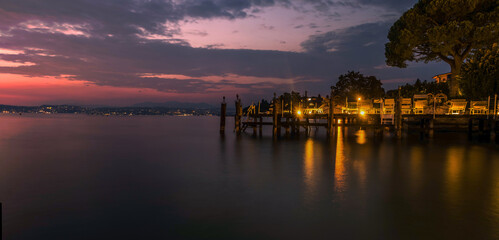 Naklejka na ściany i meble Evening in the resort of Sirmione on Lake Garda