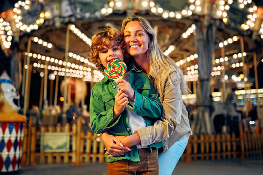 Kids having fun on a carnival Carousel