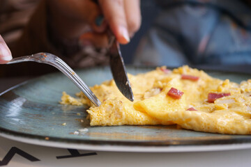women eating Plain Egg Omelette