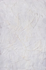 Textured handmade white textile background with mesh and paper base. Vertical background handmade for design