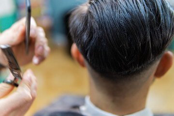 Styling straight men's hair in barber shop