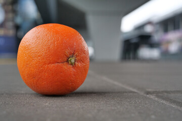 Orange lies on the pavement