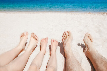 Stylish beautiful legs on the sea shore background