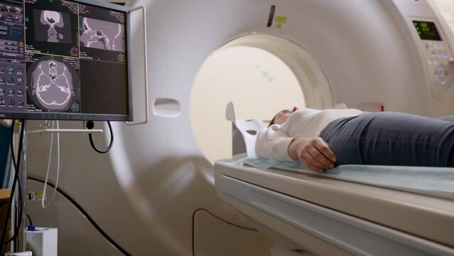 4k video computed tomography CT scan process for examination of spine. CT scanning of the spine examination for assess for herniated disk, tumors, extent of injuries, blood vessel malformations.
