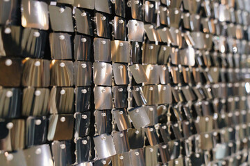 wall with sequins. iridescent and shiny plates as a decor. 