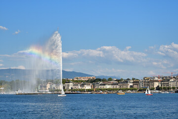 Naklejka na ściany i meble Switzerland, Geneva. A rainbow over the Jet d'Eau (Water-Jet) on Lake Geneva. August 16, 2022.