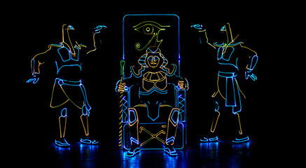 Laser show. dancers in led suits on dark background, colored show