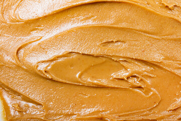 Close up photo texture of peanut butter paste.