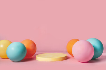 Fototapeta na wymiar Product podium stage with pastel color balloons on pink backgtound. Abstract background and decoration scene template for Spring and Easter